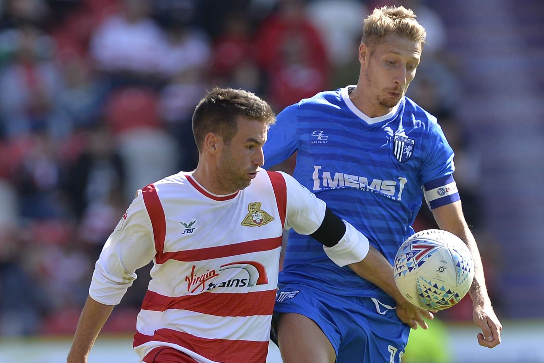 Lee Martin takes on Doncaster's Matty Blair. Picture: Ady Kerry