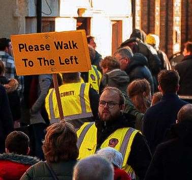 A marshal instructing crowds to keep to the left. Picture by: Taylor Williams