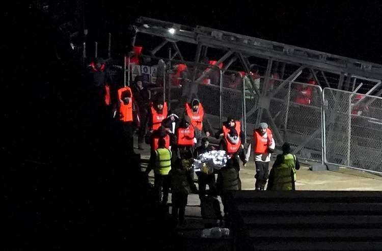 A group of people thought to be migrants were brought to Dover yesterday. Picture: Gareth Fuller/PA