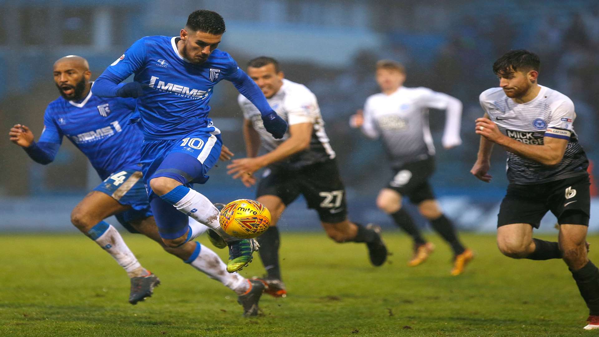 Gillingham substitute Conor Wilkinson brings the ball forward. Picture: Andy Jones