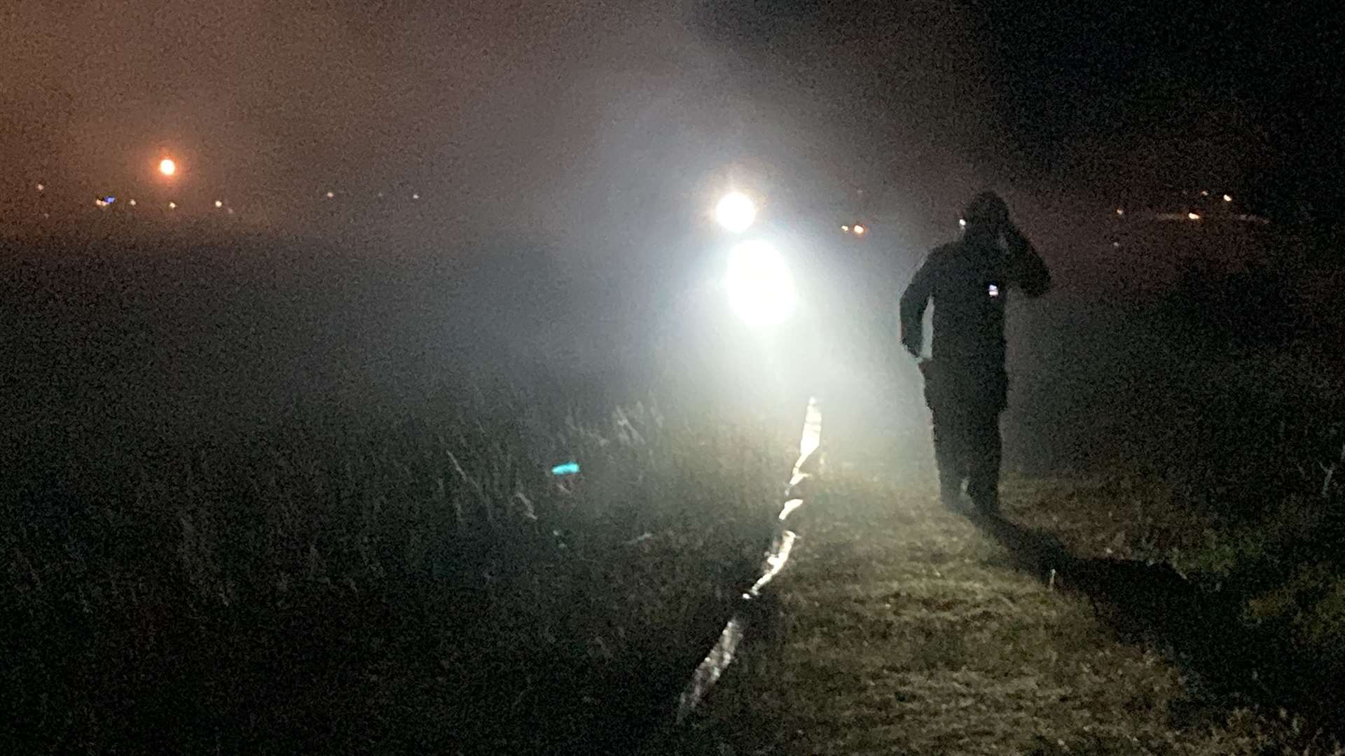 Firefighters tackle burning grass following a model aeroplane display at Barton's Point Coastal Park, Sheerness. Picture: John Nurden