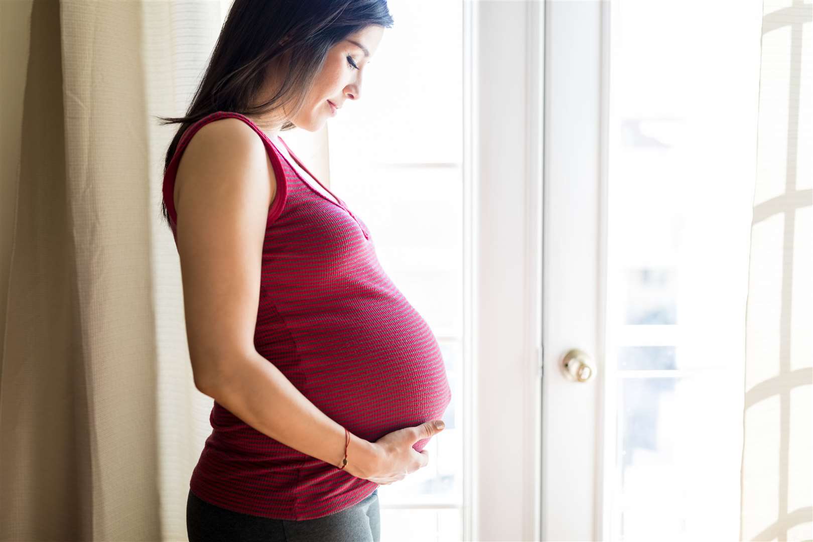 Pregnant women often turn to Baby on Board badges to help identify themselves to fellow passengers. Image: iStock.