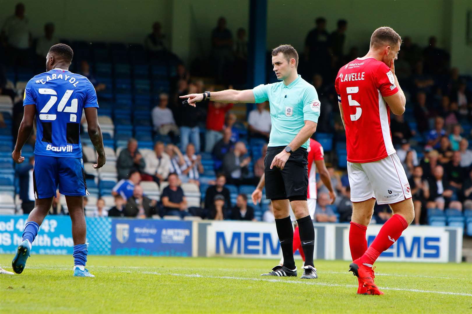 Referee Tom Nield points to the spot to give Gillingham a penalty against Morecambe. Picture: Andy Jones (50452501)