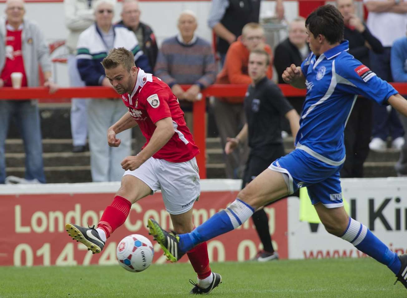 Hat-trick hero Matty Godden crosses despite the attentions of Laurence Harvey Picture: Andy Payton