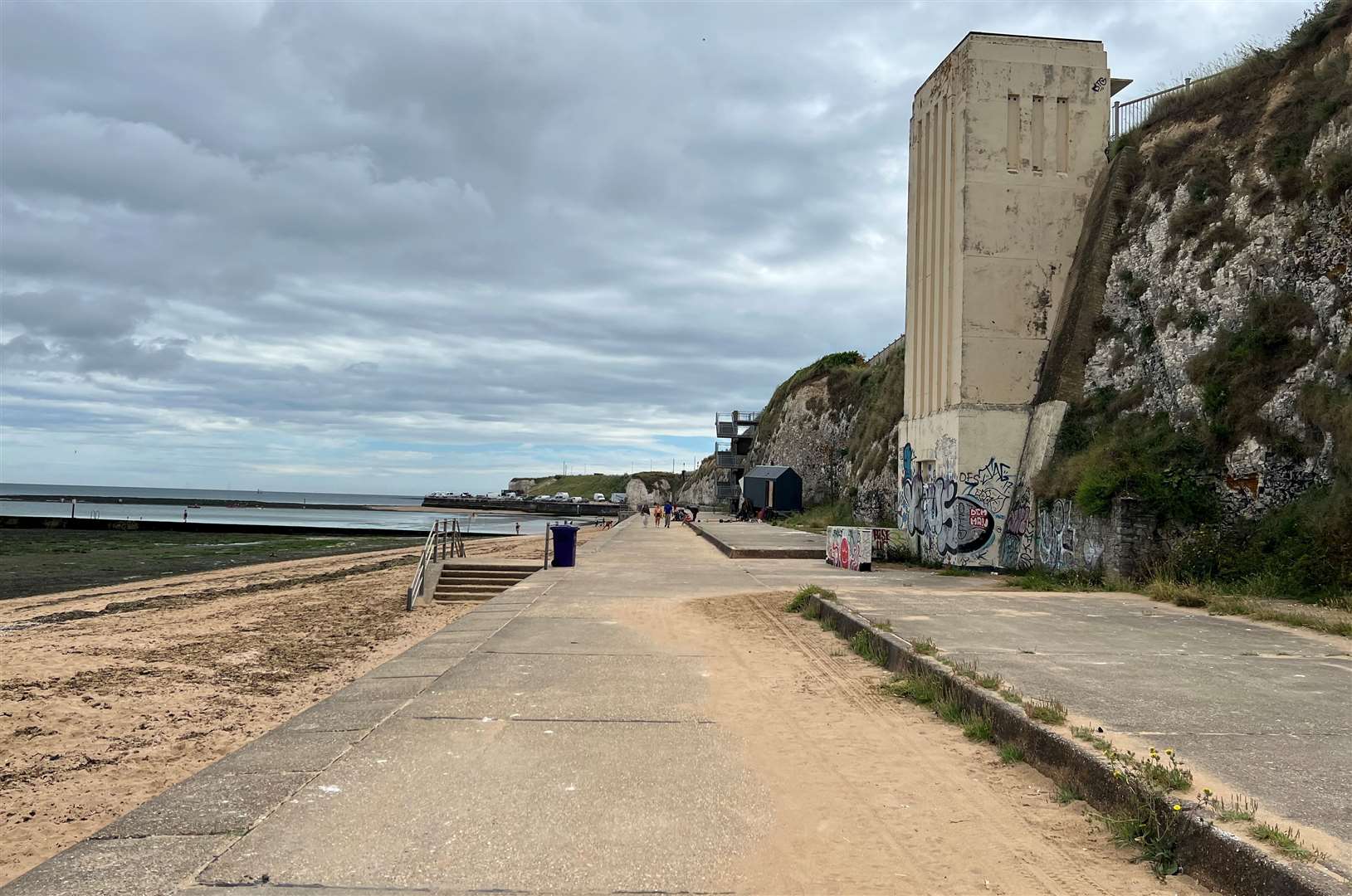 The art deco lift no longer in use from the sea path - with the tidal pool just behind