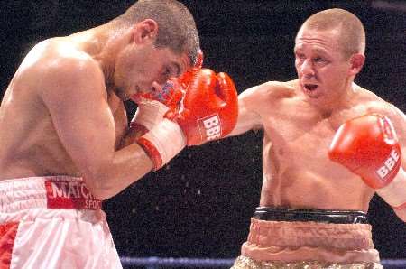 Johnny Armour gets a punch in on Tuncay Kaya during Thursday night's fight. Picture: MATT WALKER