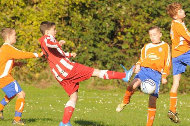 Cuxton 91, in orange, battle Strood United in Under-12 Division 1. Picture: Steve Crispe