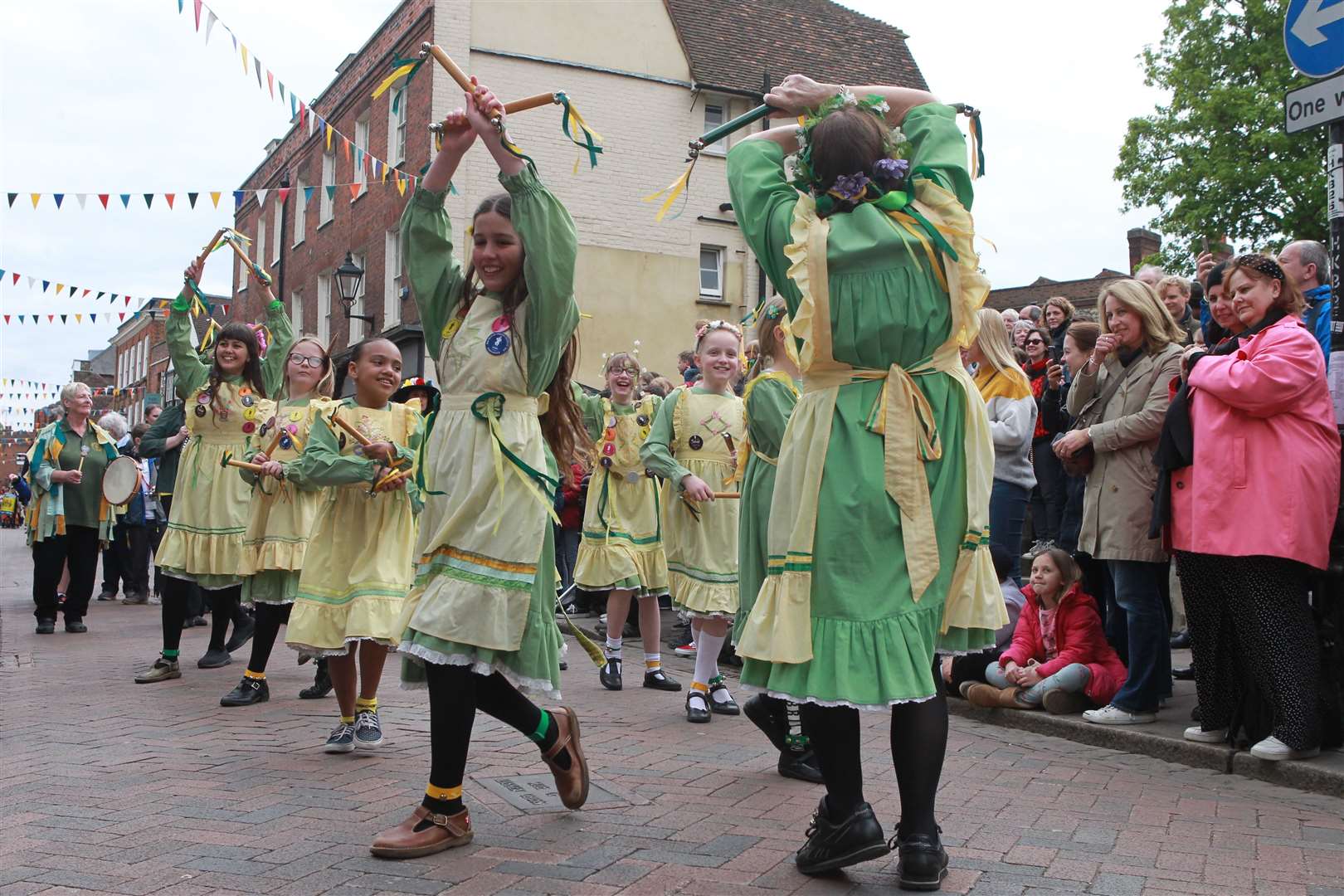 Morris dancers in a long procession through Rochester High Street at The Sweeps Festival in Rochester. Picture by: John Westhrop (9744828)