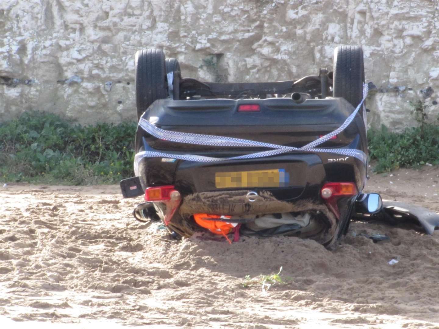 A Nissan Juke landed on its roof on Joss Bay, Broadstairs. Picture: Derek T Ives