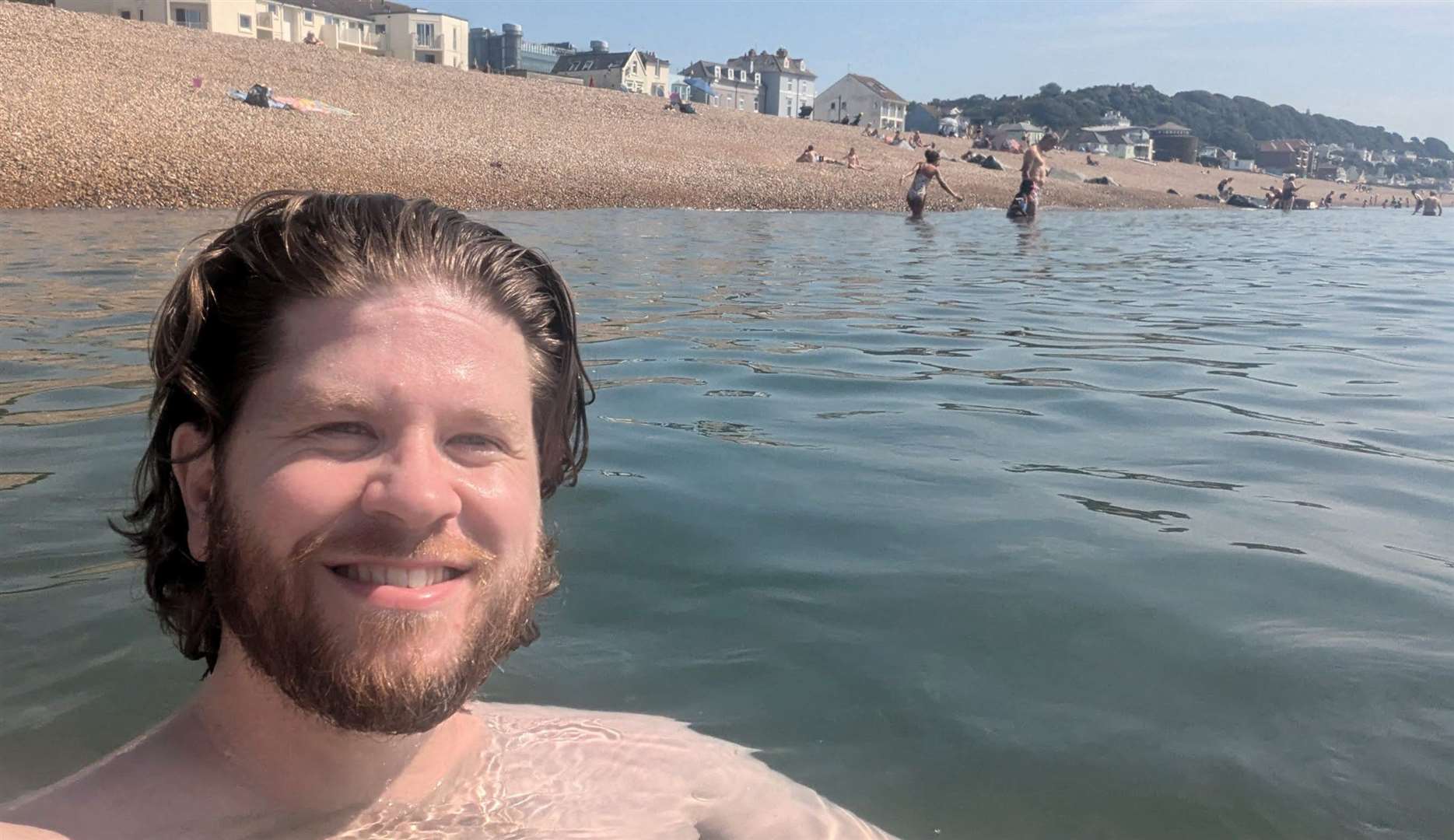 Reporter Rhys Griffiths taking a dip in the sea off Sandgate beach