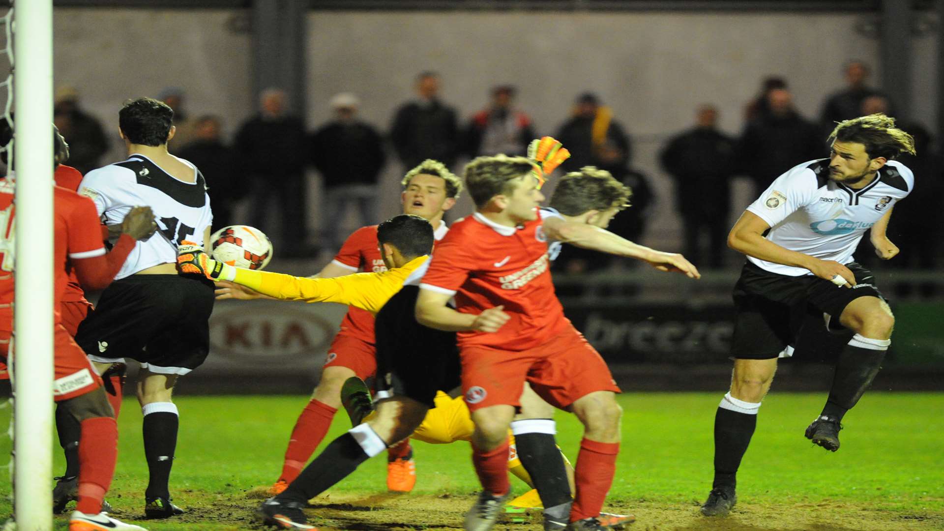 Ronnie Vint (right) goes for goal as Danny Harris has his shirt pulled Picture: Steve Crispe