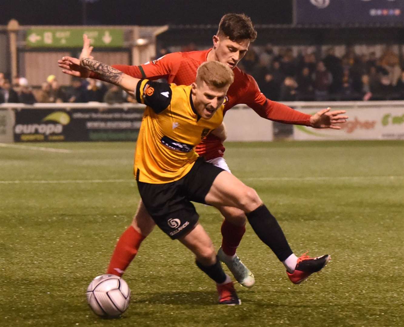 Maidstone striker Jack Barham keeps Jack Paxman at bay Picture: Steve Terrell