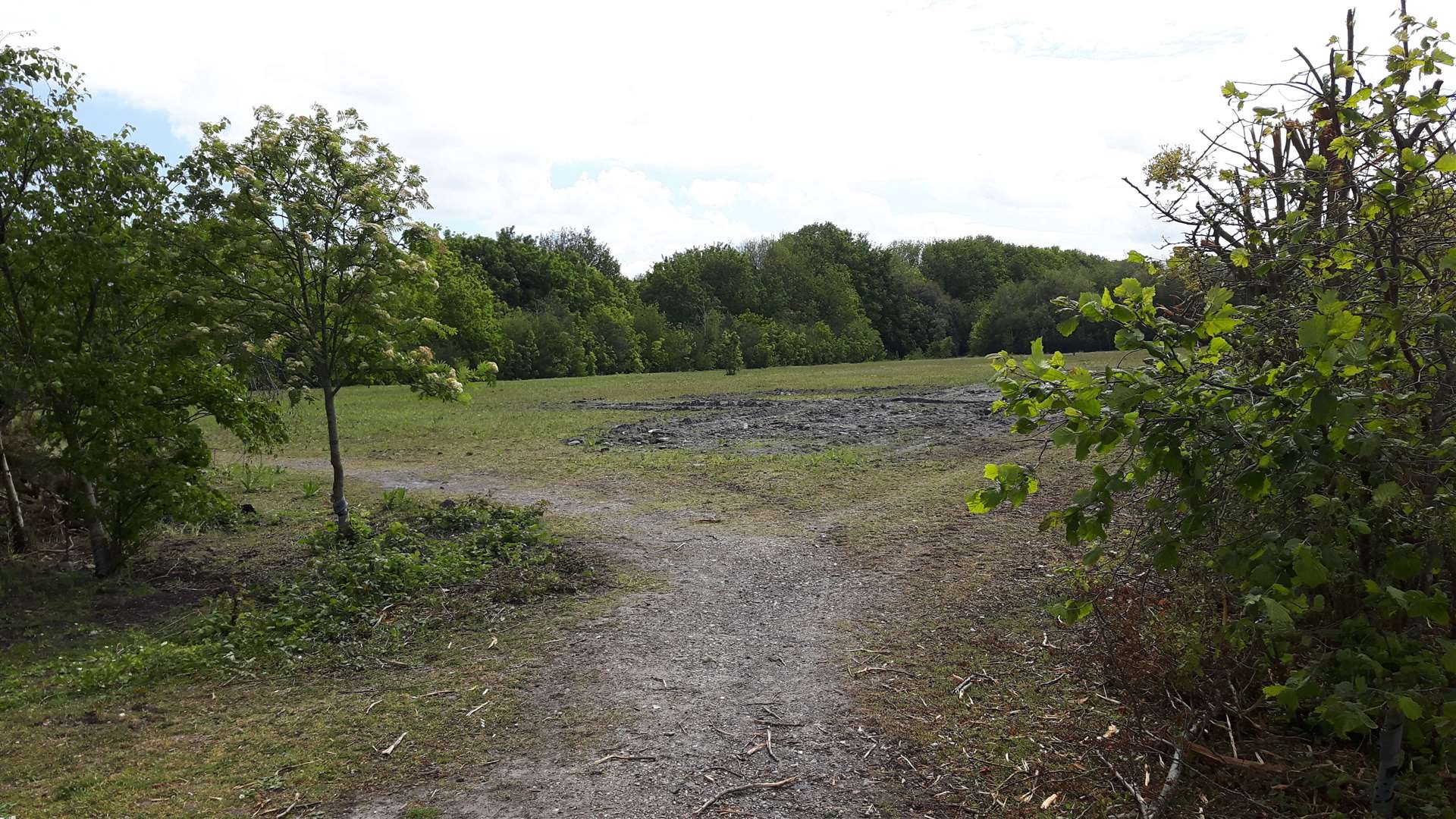 The development site at Colliers Way is adjacent to the man made fishing lake and opposite Almond House in Betteshanger