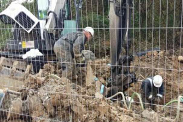 Engineers repairing the damaged gas main