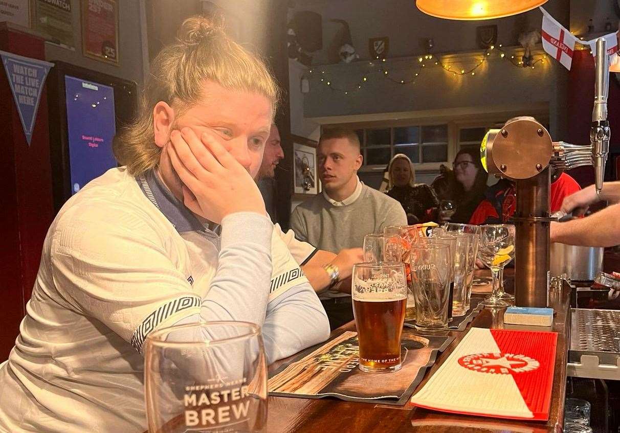 Rhys Griffiths in despair at The Nailbox pub in Cheriton, Folkestone, after England were knocked out of the 2022 World Cup by France