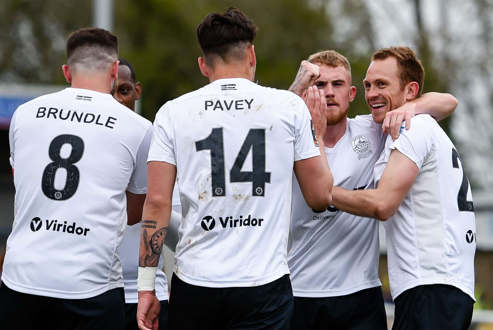 Stuart Lewis, far right, celebrates scoring Dover's opening goal against Sutton United on Saturday Picture: Alan Langley