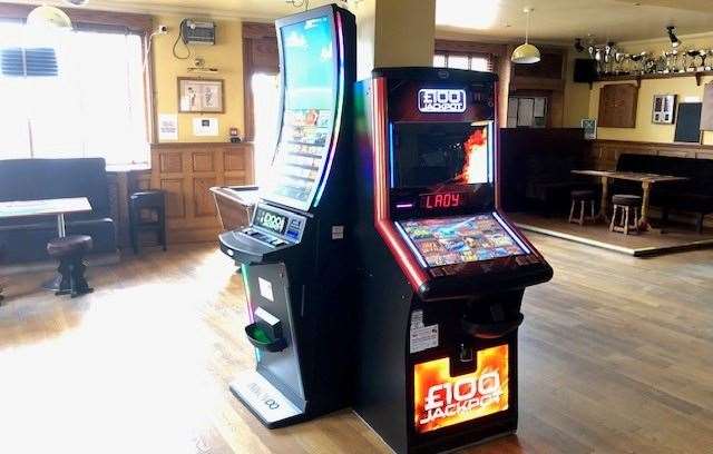 There were fruit machines stacked around a central pillar in the pub