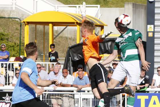 Ashford's Shaun Welford gets the better of Cray keeper Jordan Carey to head the winning goal Picture: Andy Jones