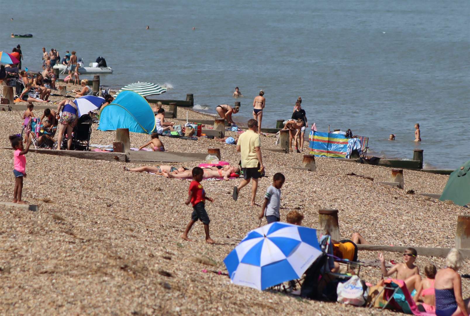 Bathers at the Leas at Minster on the Isle of Sheppey on one of the hottest days of 2020