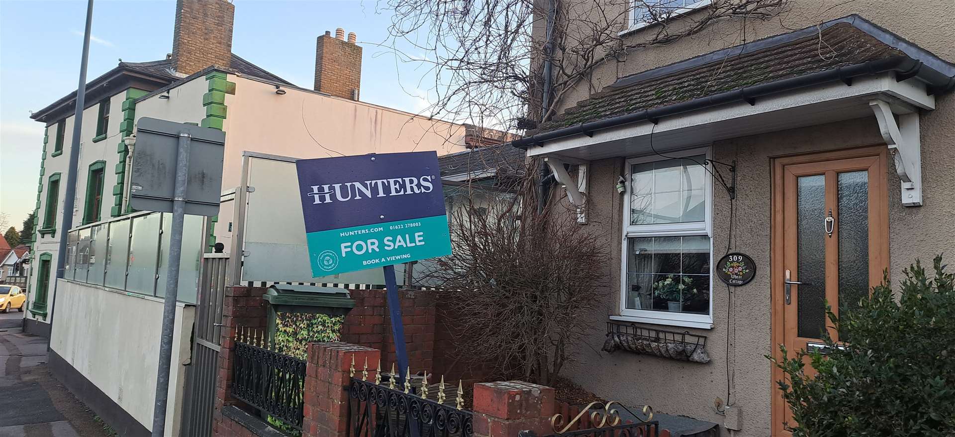 Some motorists mistook the For Sale sign to be for the Wheatsheaf but it is for the cottage next door