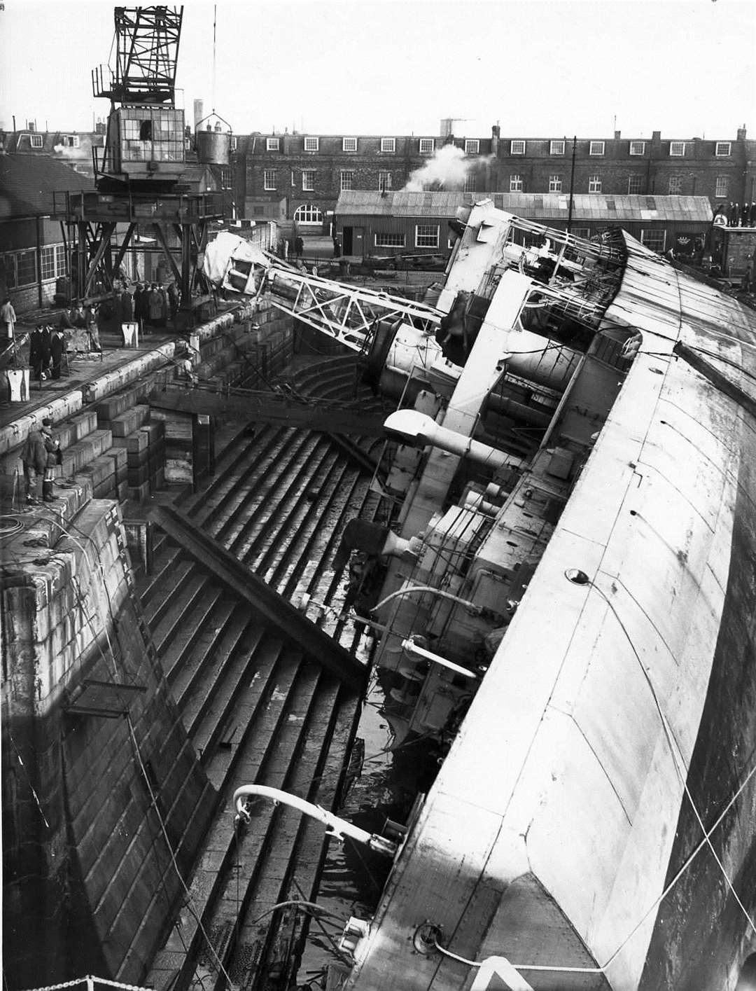 HMS Berkeley Castle capsized at Sheerness Docks during floods in 1953 Negative Reference: 20018 (61731039)