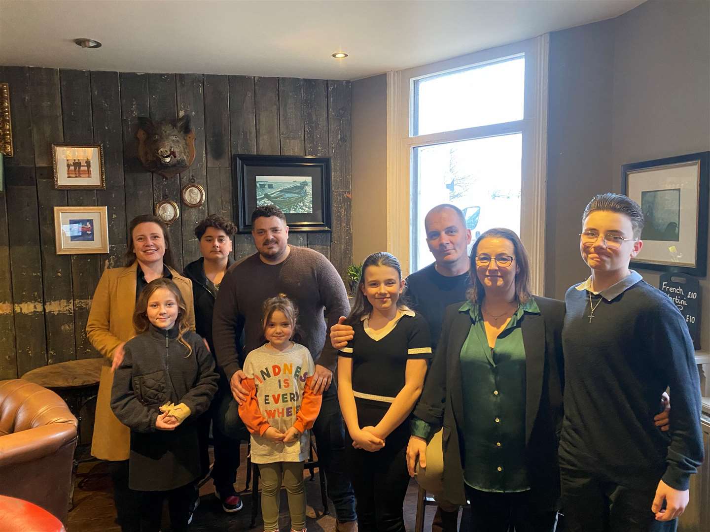 Landlords Jake Alder, centre left, and Jerome Engramer (centre right), with their families at the Pearson's Arms in Whitstable