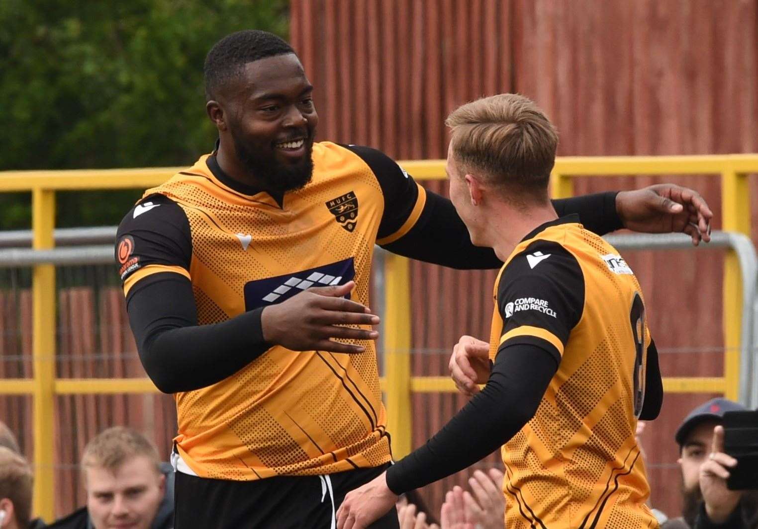 Jerome Binnom-Williams congratulates Sam Corne on his second goal at Hemel Hempstead Picture: Steve Terrell