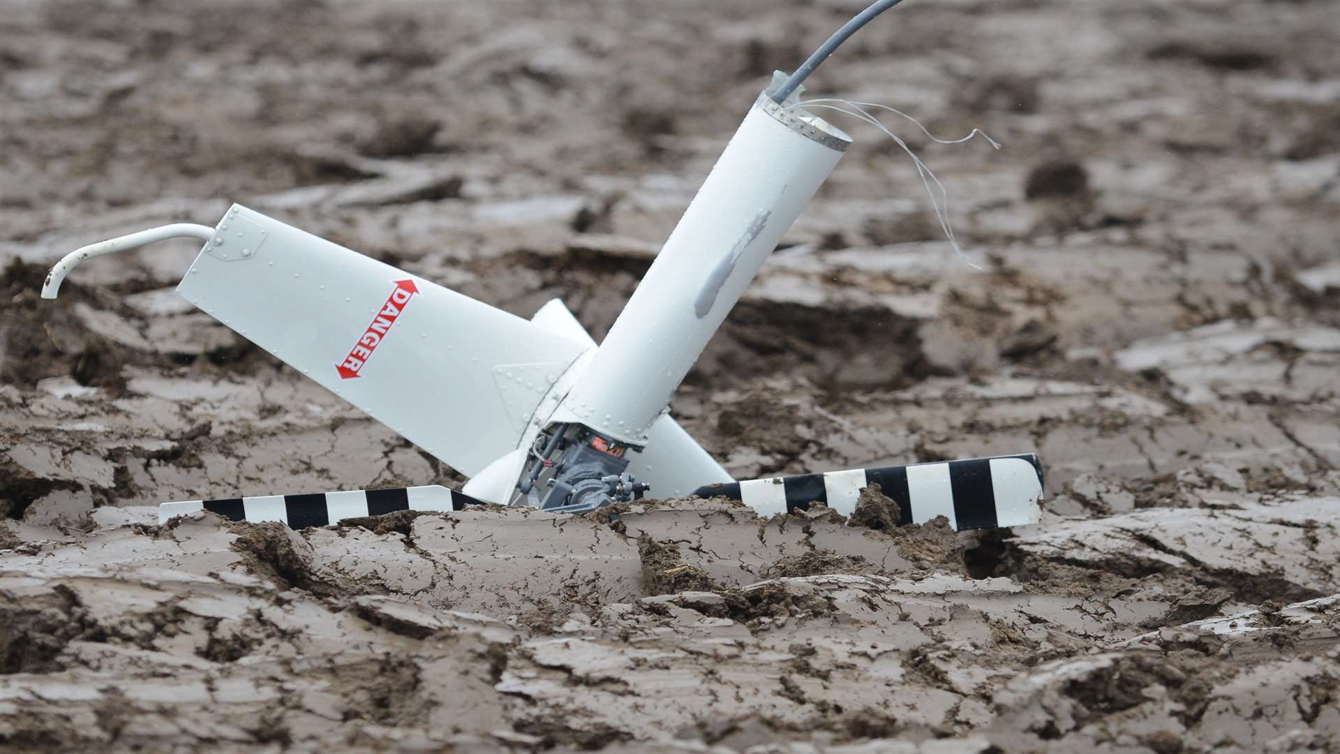 The rear rotor blade lodged in the mud. Picture: Gary Browne