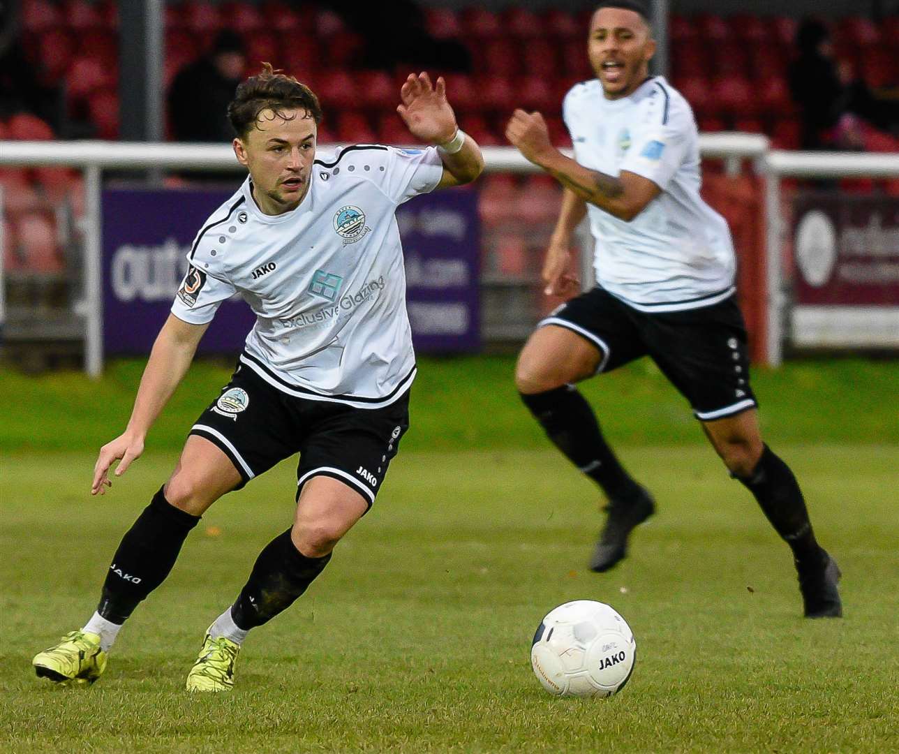 Dover midfielder Jack Munns looks for space with Aaron Simpson offering support Picture: Alan Langley