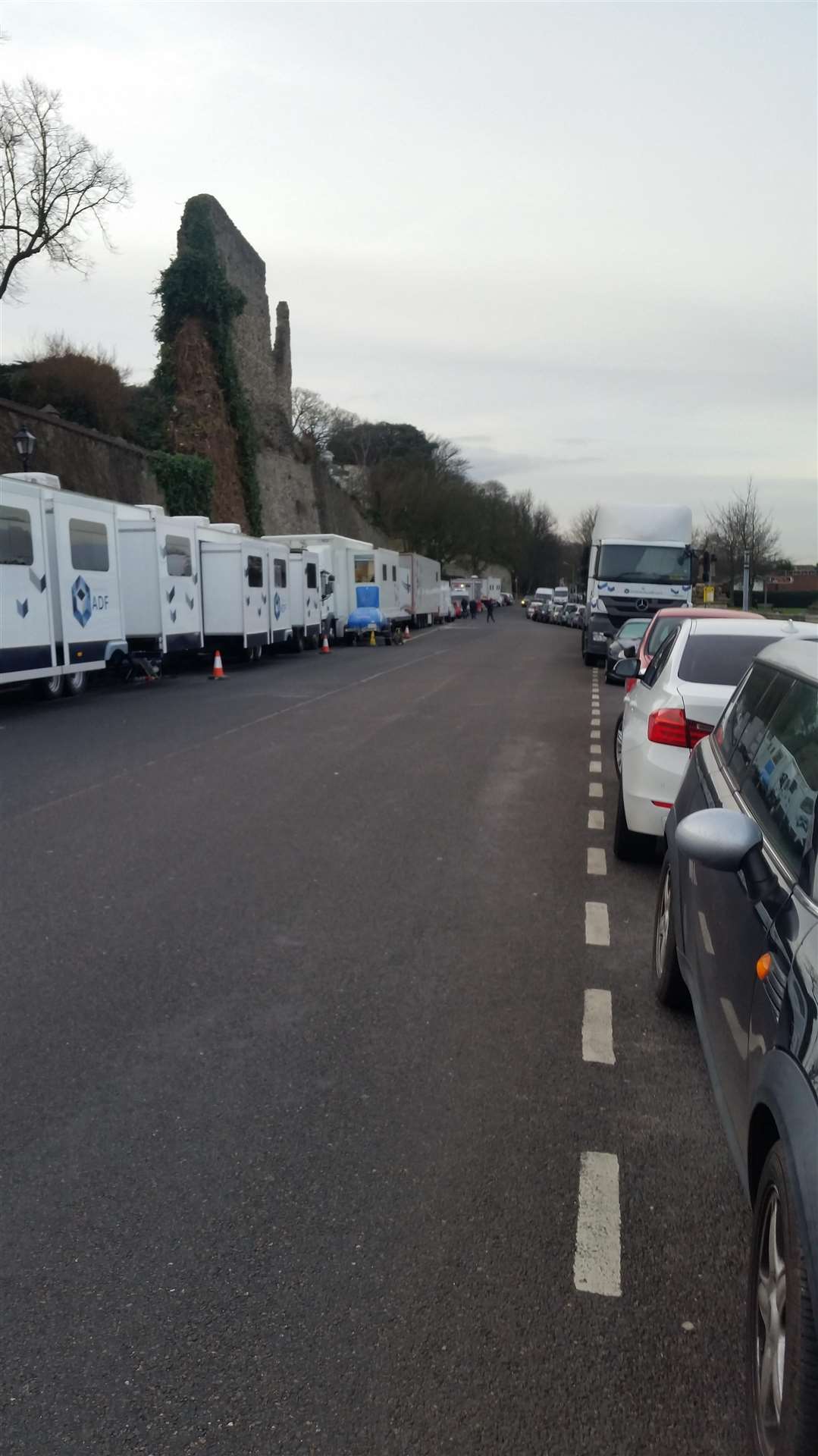 Trailers and lorries line either side of Esplanade, in Rochester (6826587)