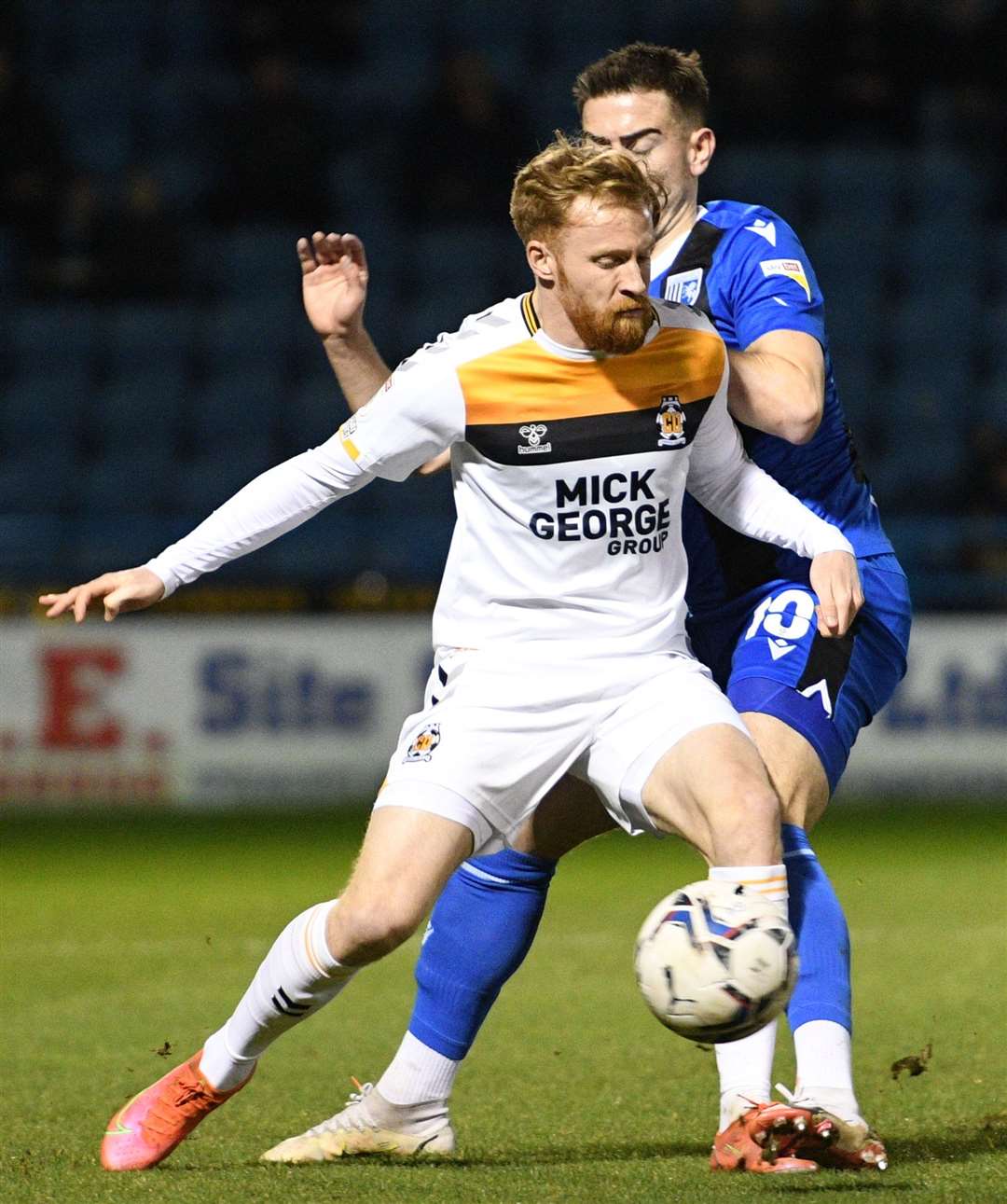 The visitors' Sam Smith is tackled by Gillingham's Olly Lee. Picture: Barry Goodwin