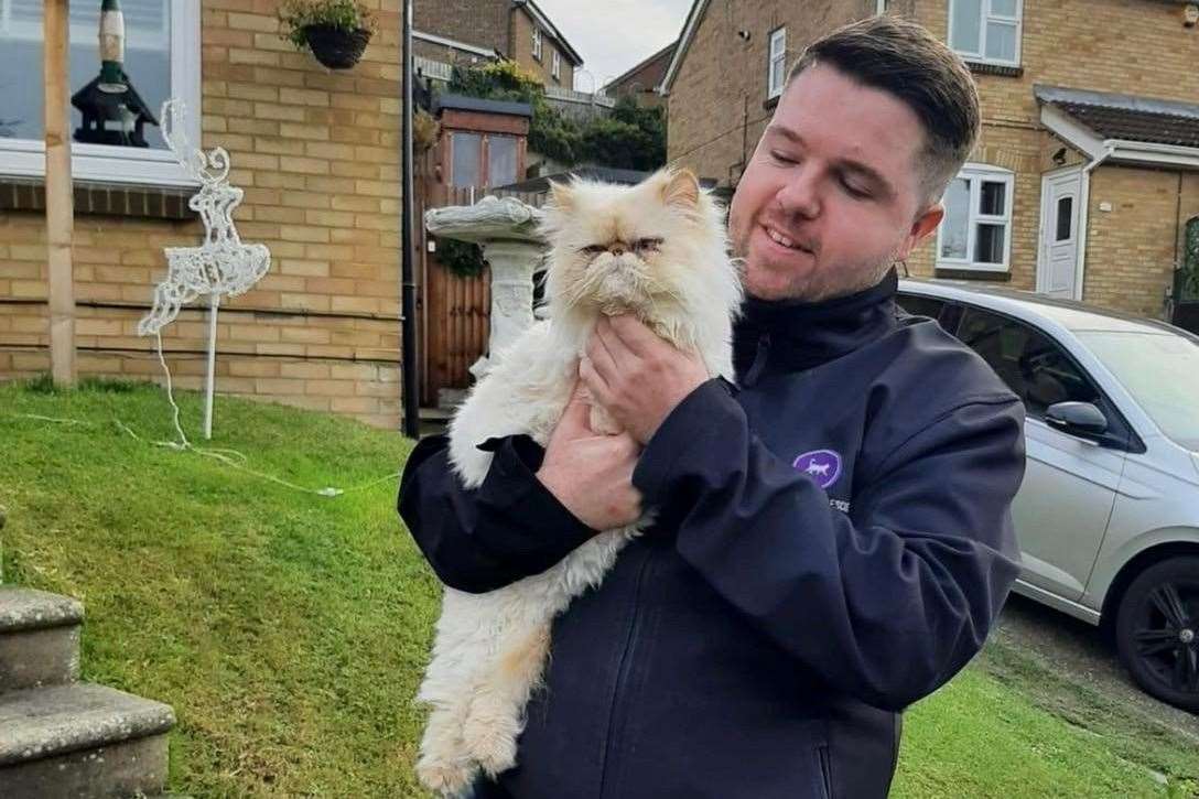 Billy Devitt and Arthur, the grumpy cat . Picture: Wisteria Cat Rescue