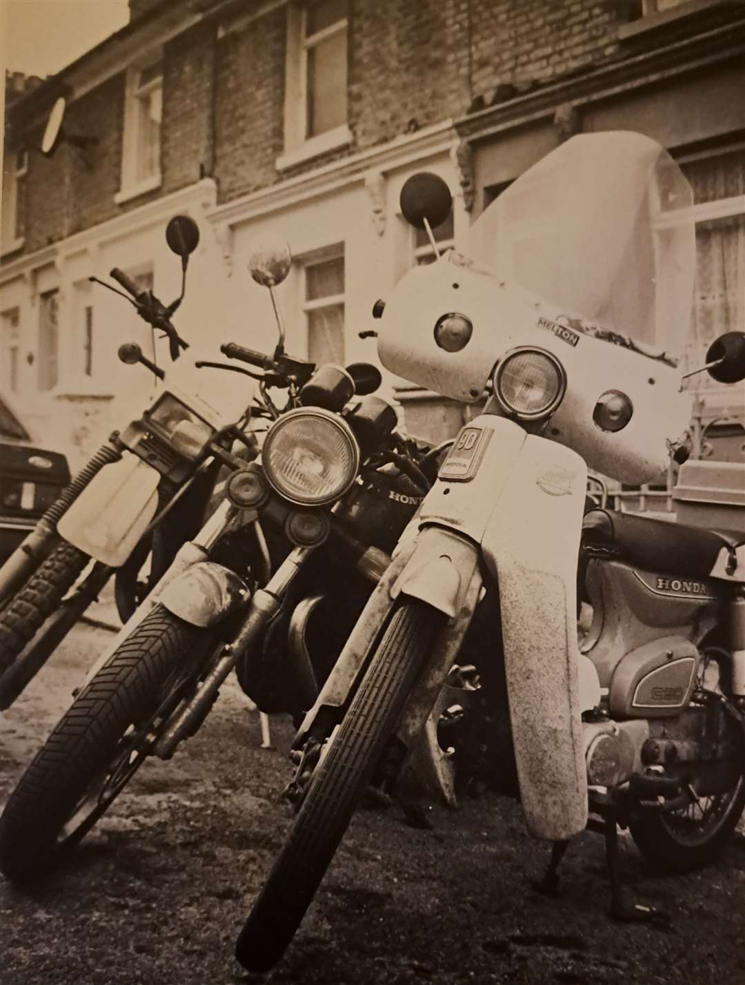 Reporter Sam Lennon's Honda C90, right, and those of biker pals, in 1992. Picture: Colin Mearns