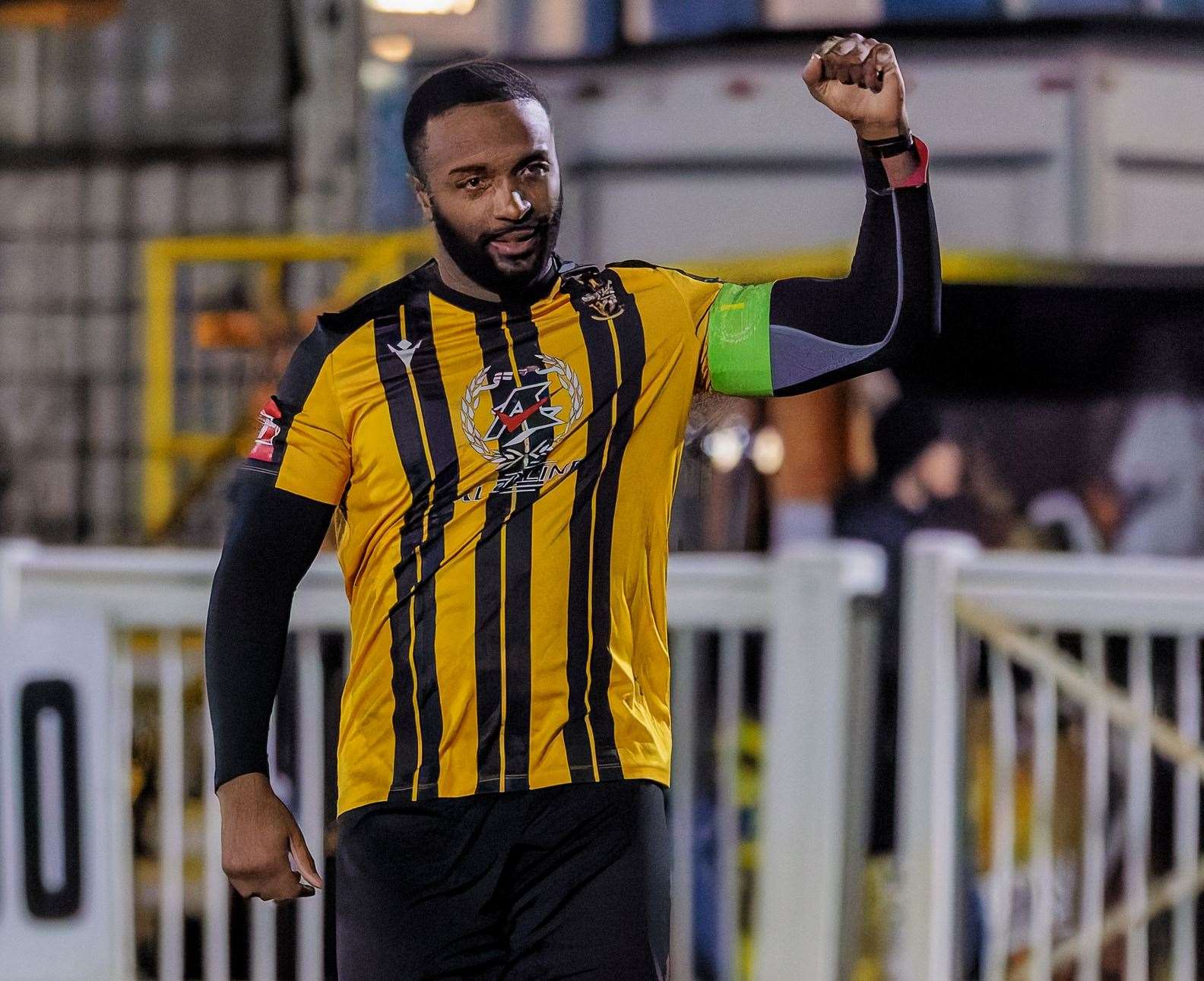 Folkestone captain Ian Gayle celebrates victory against Dulwich Hamlet at the full-time whistle. Picture: Helen Cooper