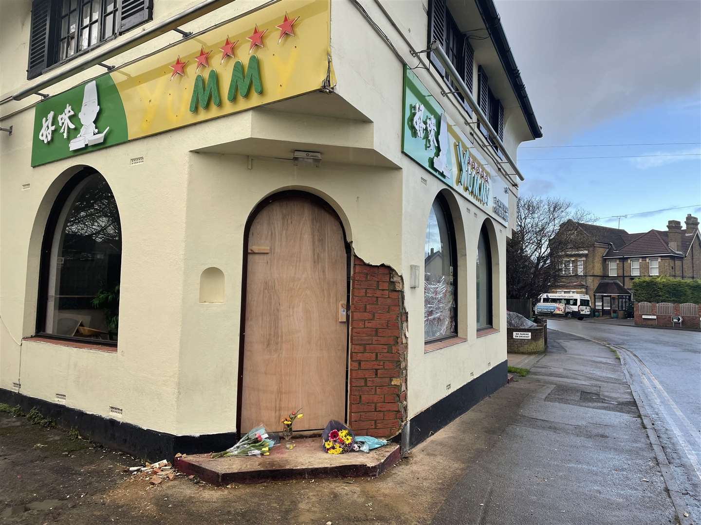 Floral tributes were left at the doorstep of the takeaway following the fatal motorcycle incident on January 2