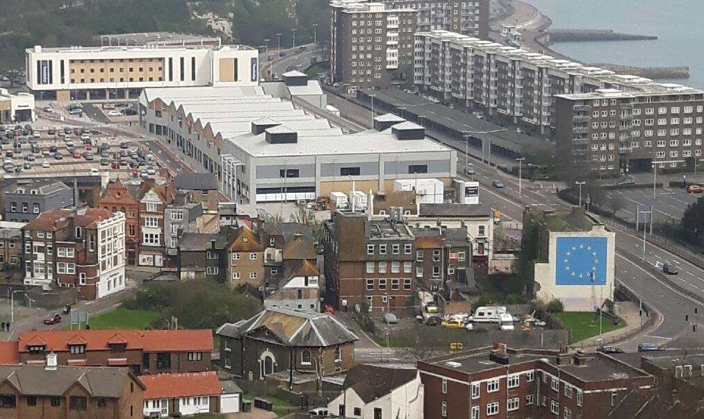 Panoramic view of St James' and the Banksy mural with the Crypt area in between