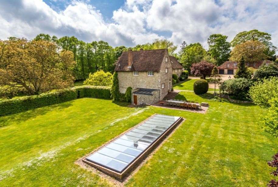 The luxurious swimming pool can be spotted from above the property by its glass roof. Picture: Hamptons