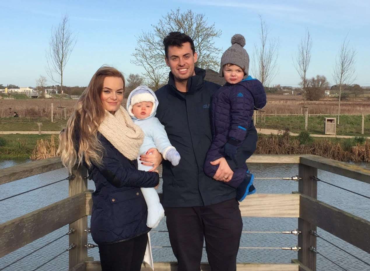 Sam Phayer with his family, mum Ally and dad Ryan holding his brother George, before he was diagnosed