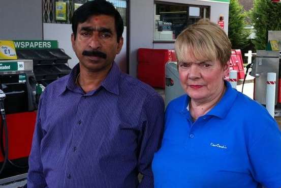 Victim Lekshmanan Asokkumar with wife Judie outside the Texaco garage