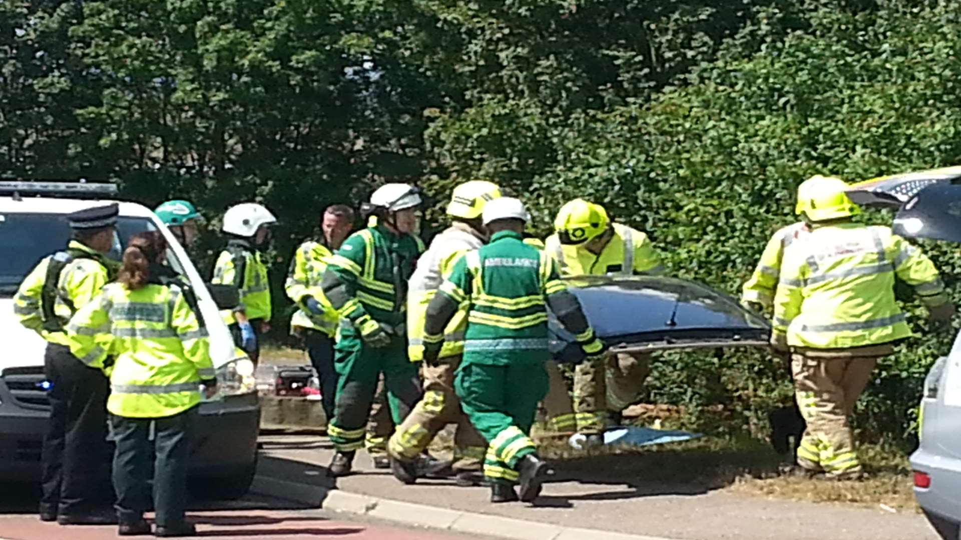 The roof of the car has been cut off by fire crews