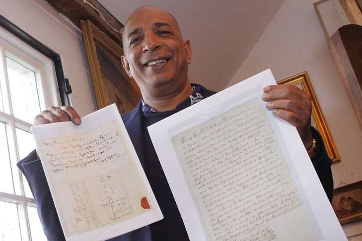 Bentley's Auction House owner Raj Bisram with copies of Nelson's will