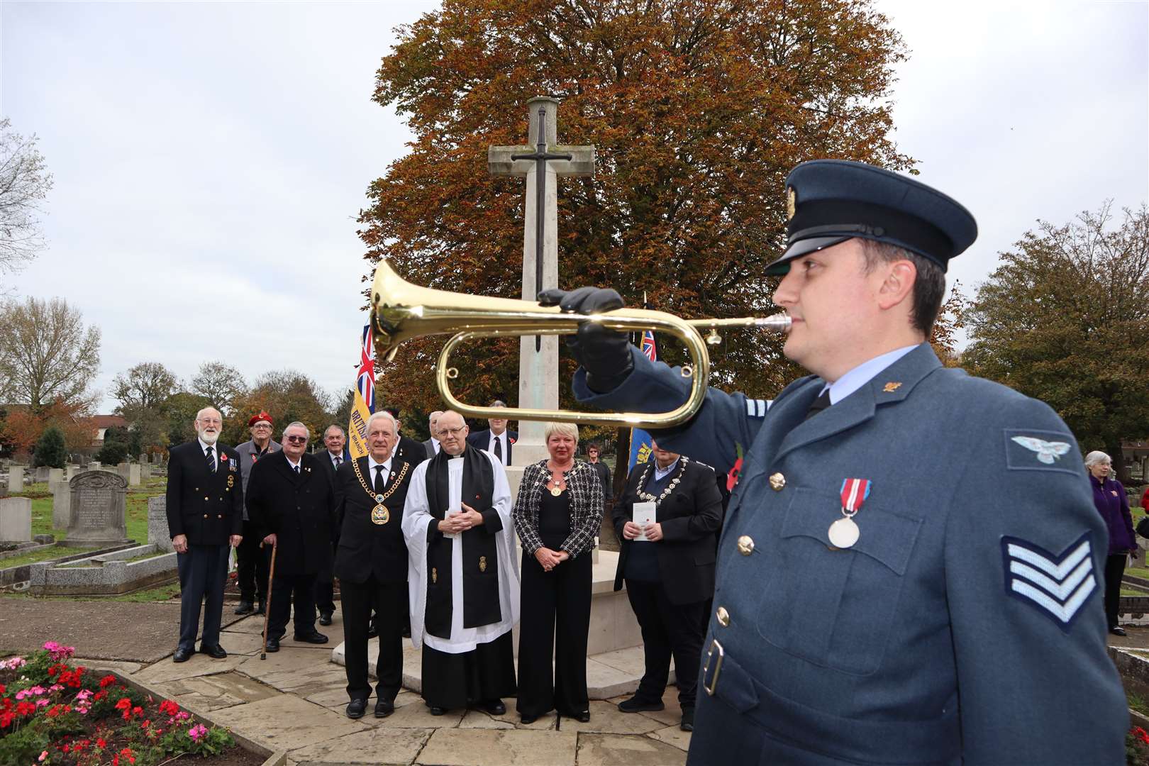 Bugler James Crane of Sheppey Air Cadets at Halfway cemetery with the mayor and mayoress of Swale Cllrs Paul and Sarah Stephen