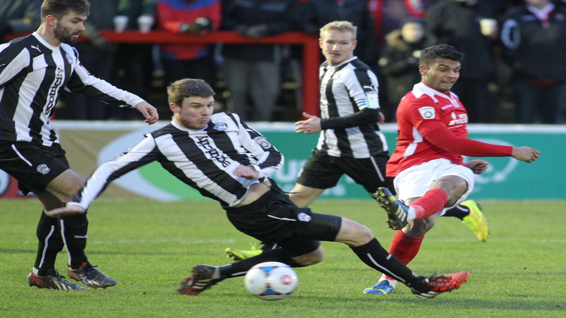 Theo Lewis, on his Ebbsfleet debut, gets a shot away under pressure Picture: John Westhrop