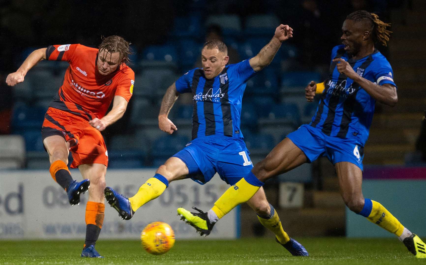 Barry Fuller and Gabriel Zakuani try to block a shot from Alex Samuel Picture: Ady Kerry