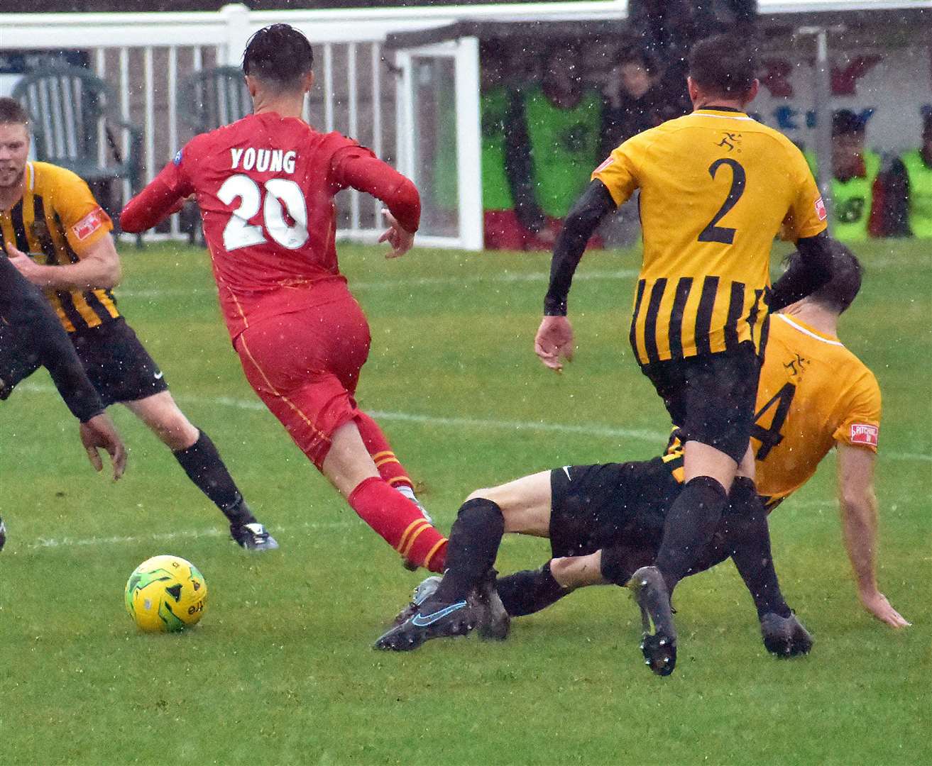 Folkestone's Matt Newman challenges Gloucester City man Jordan Young. Picture: Randolph File