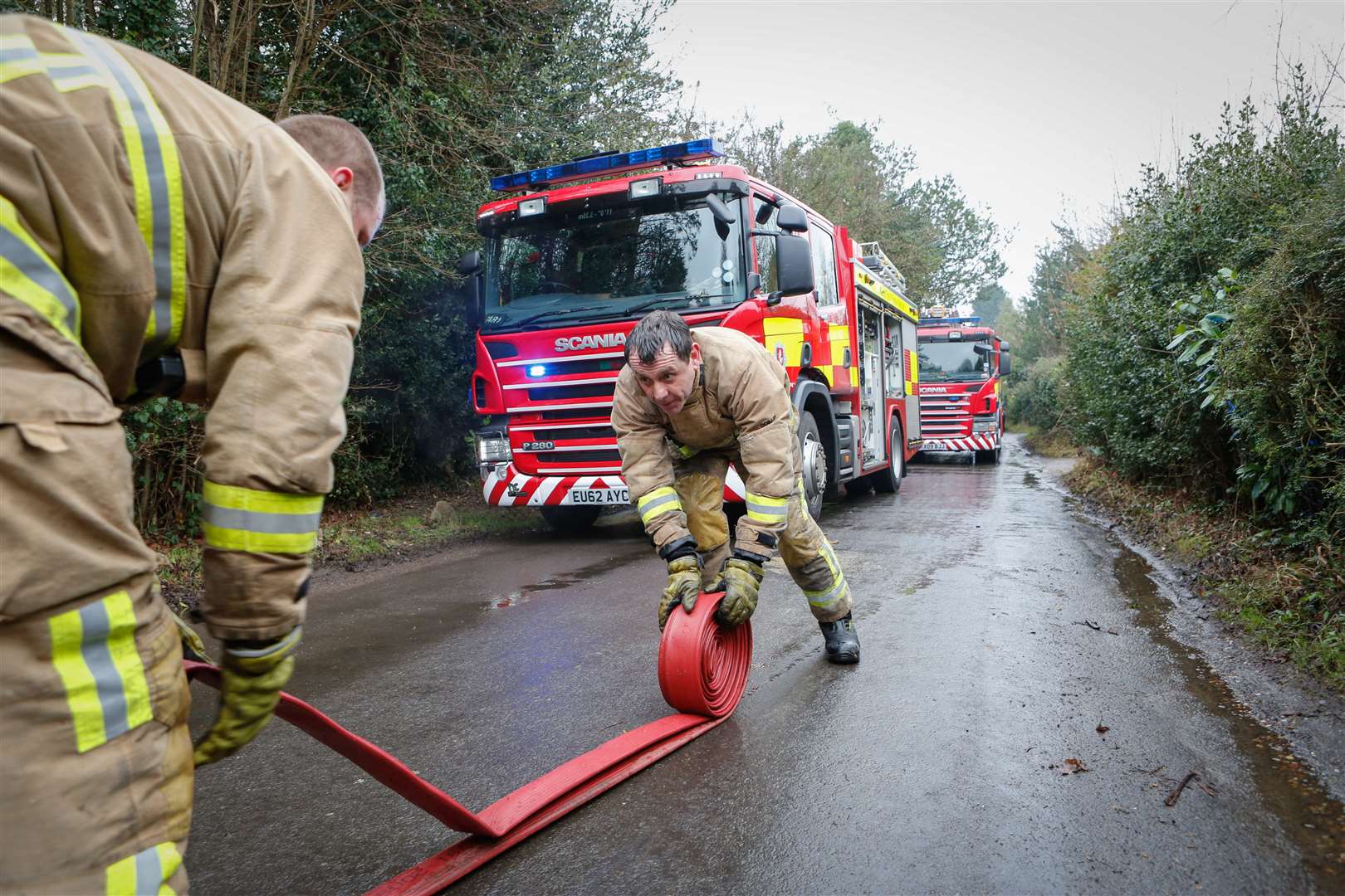 Firefighters clean up after the blaze in Pembury