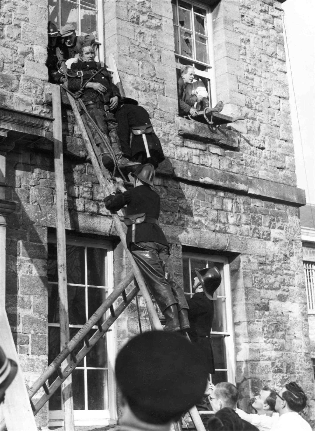 Patients being evacuated from the hospital during the fire in 1957