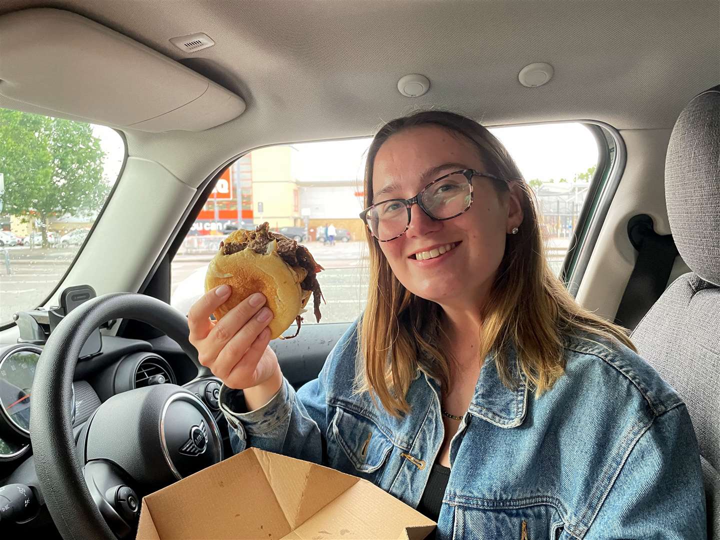 Tucking into my burger in the car park