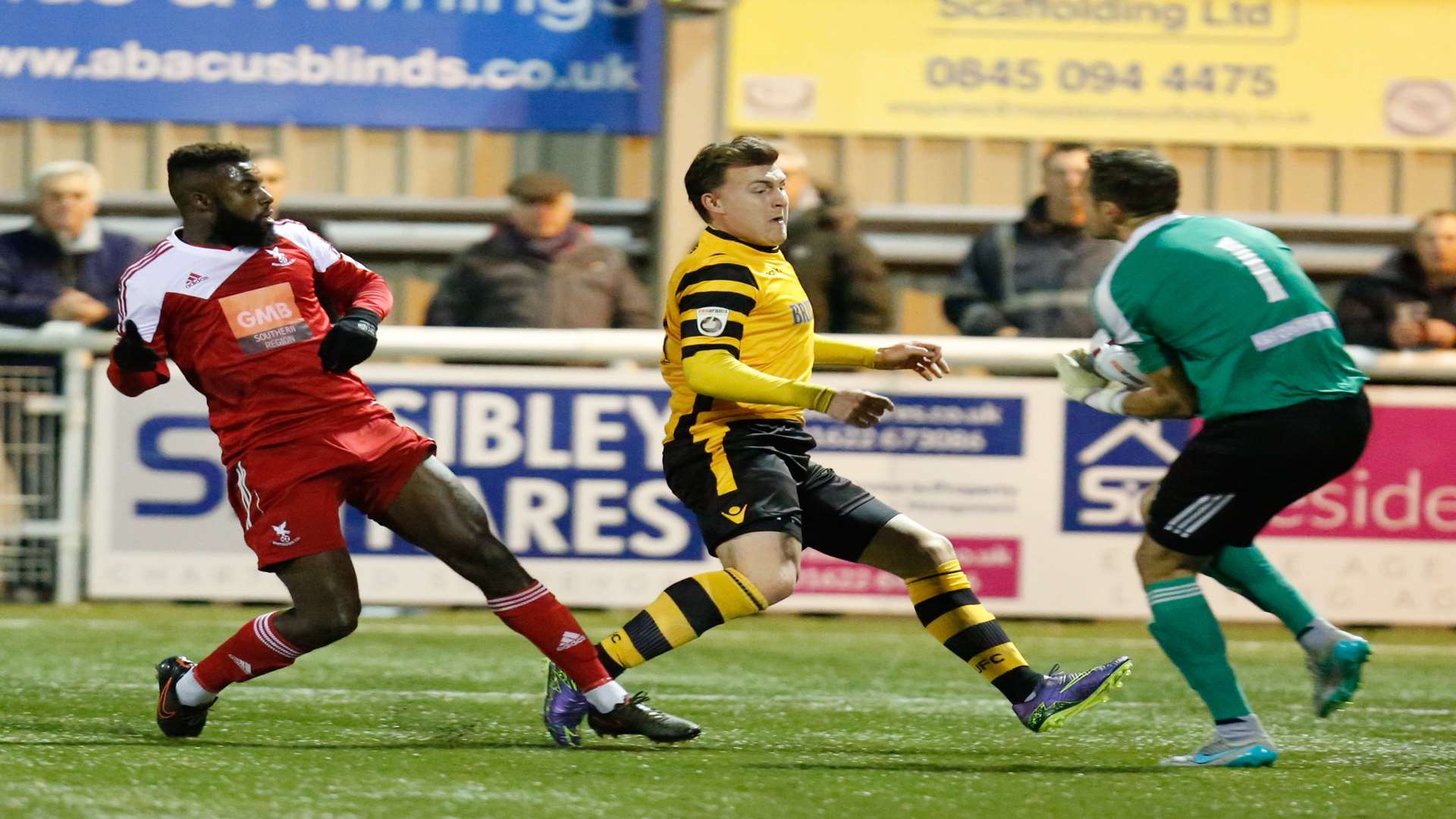 Craig Ross gets to the ball ahead of Alex Flisher as Chris Sessegnon looks on Picture: Matthew Walker