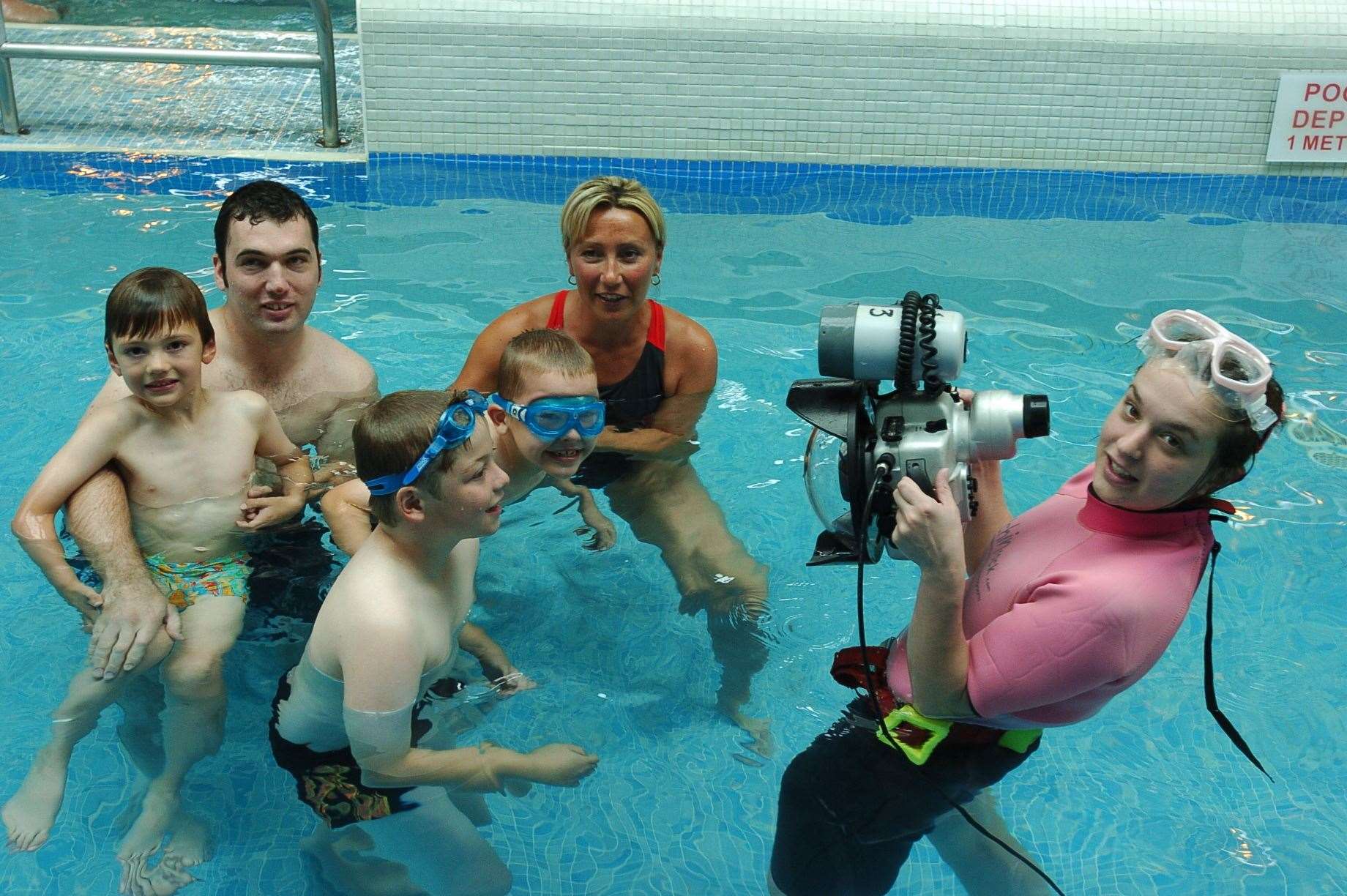 A family fun day in 2007. Lynda Laird taking under water photos of the swimmers